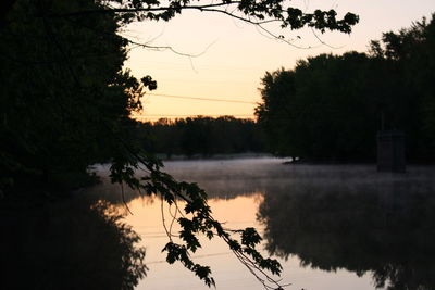 Scenic view of lake at sunset