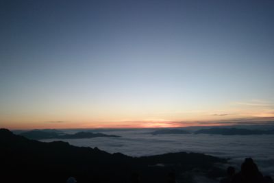 Scenic view of silhouette mountains against clear sky