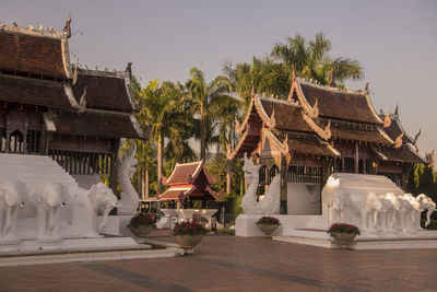 Temple against building and sky