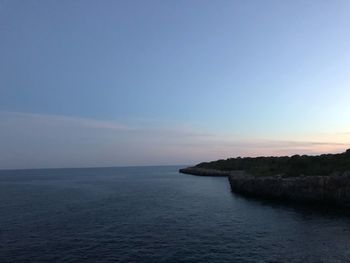 Scenic view of sea against sky at sunset