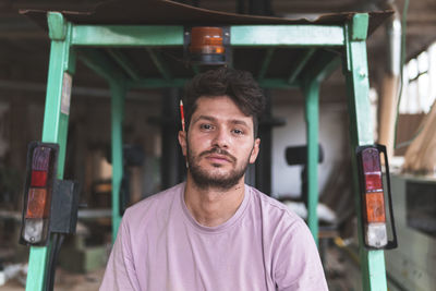 Portrait of young man standing outdoors