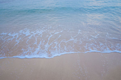 High angle view of surf on beach