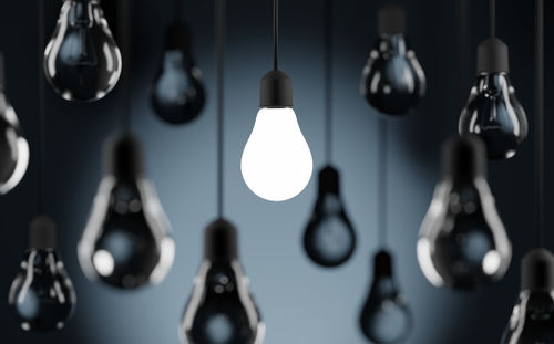 Close-up of light bulb hanging