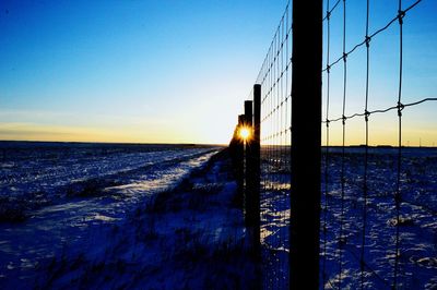 Scenic view of sea against clear sky during winter