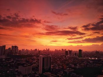 Cityscape against sky during sunset