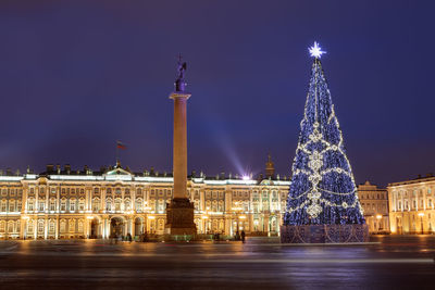 Illuminated buildings in city at night