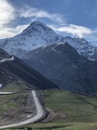 Scenic view of snowcapped mountains against sky