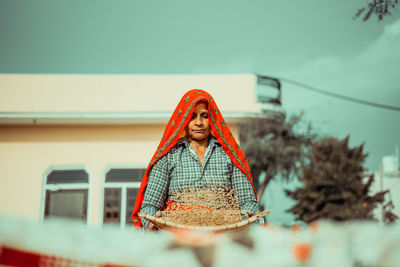 Portrait of an  indian rural woman doing daily chores