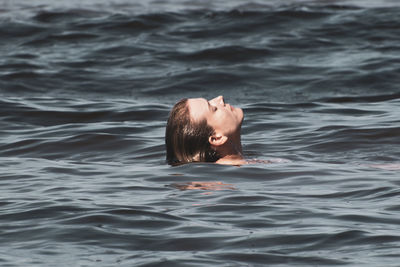 Portrait of man swimming in sea