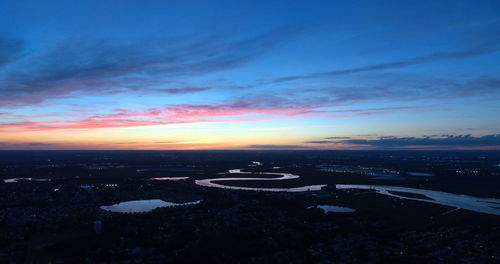 Scenic view of sunset over city
