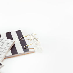 High angle view of telephone on table against white background