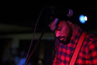 Young man performing at nightclub