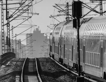 Train at railroad tracks in city