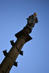 Low angle view of statue of liberty against clear sky