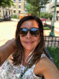 Portrait of smiling woman wearing sunglasses