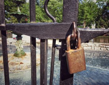 Close-up of padlocks on railing