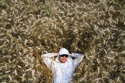 Woman standing on grassy field