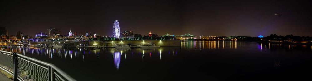 Illuminated city at waterfront