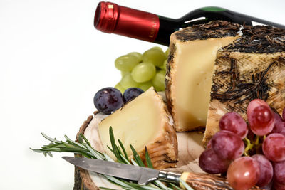 Close-up of fruits on table against white background