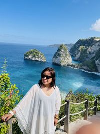 Woman wearing sunglasses while standing outdoors