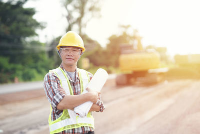 Portrait of man working at construction site