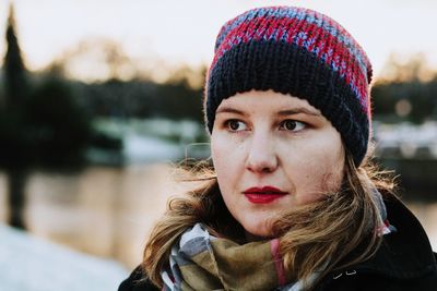 Close-up portrait of young woman in winter