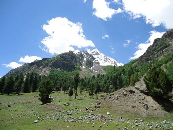 Scenic view of mountains against cloudy sky