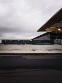 Blurred motion of illuminated bridge against sky