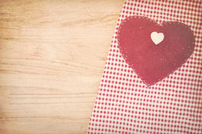 Close-up of red heart shape on table