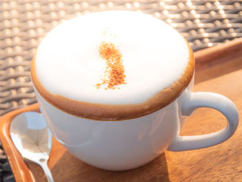 Close-up of coffee cup on table