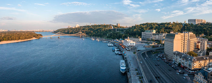 Sunset over summer kiev with arch of friendship of peoples.