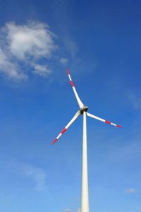 Low angle view of wind turbine against sky