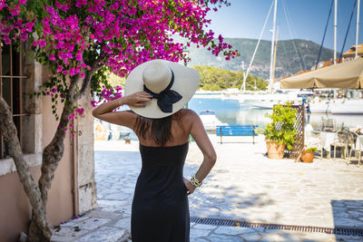 Rear view of woman looking at harbor