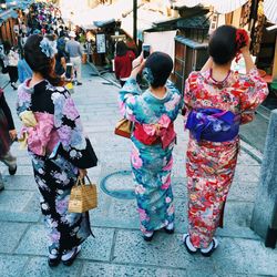 Women in traditional clothing in alley