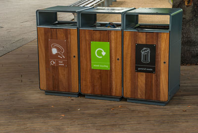 Information sign on table against wall