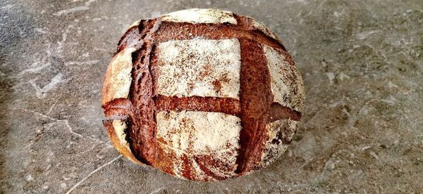 High angle view of bread on rusty metal