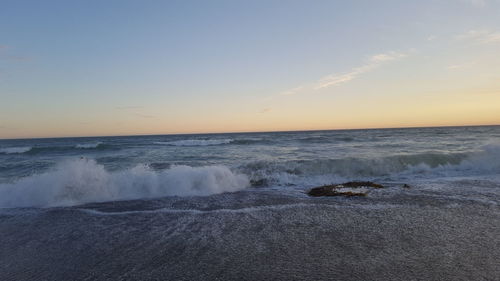 Scenic view of sea at sunset