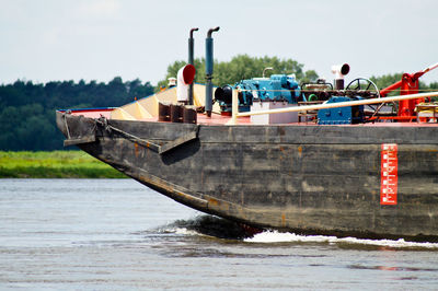 Barge in elbe river against sky