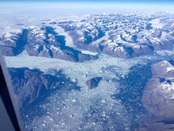 Aerial view of frozen sea against sky