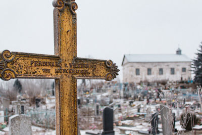 Close-up of cross against clear sky