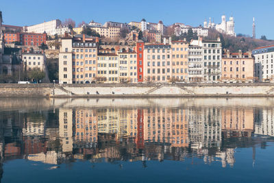 Reflection of old buildings in river