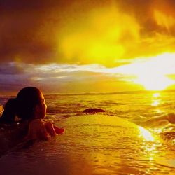 Scenic view of dramatic sky over sea during sunset