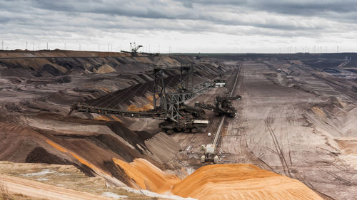 High angle view of machinery on landscape against sky