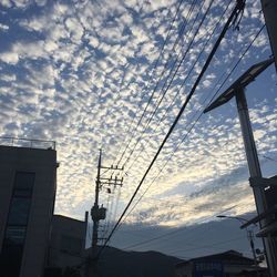 Low angle view of silhouette buildings against sky during sunset