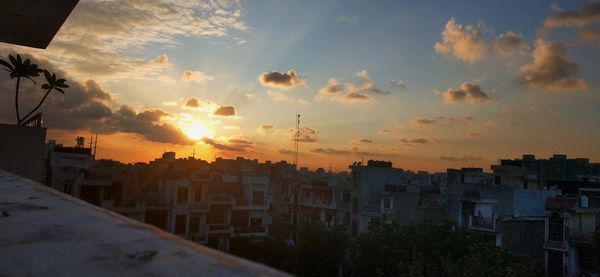 High angle view of buildings against sky during sunset