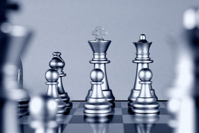 Close-up of chess pieces on table