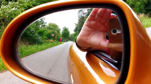 Cropped image of car on road