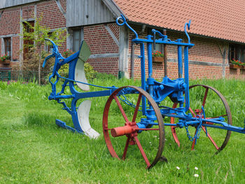 Bicycle parked in lawn outside house