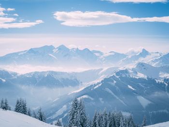 Scenic view of snow covered mountains against sky