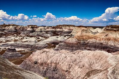 View of rock formations against cloudy sky